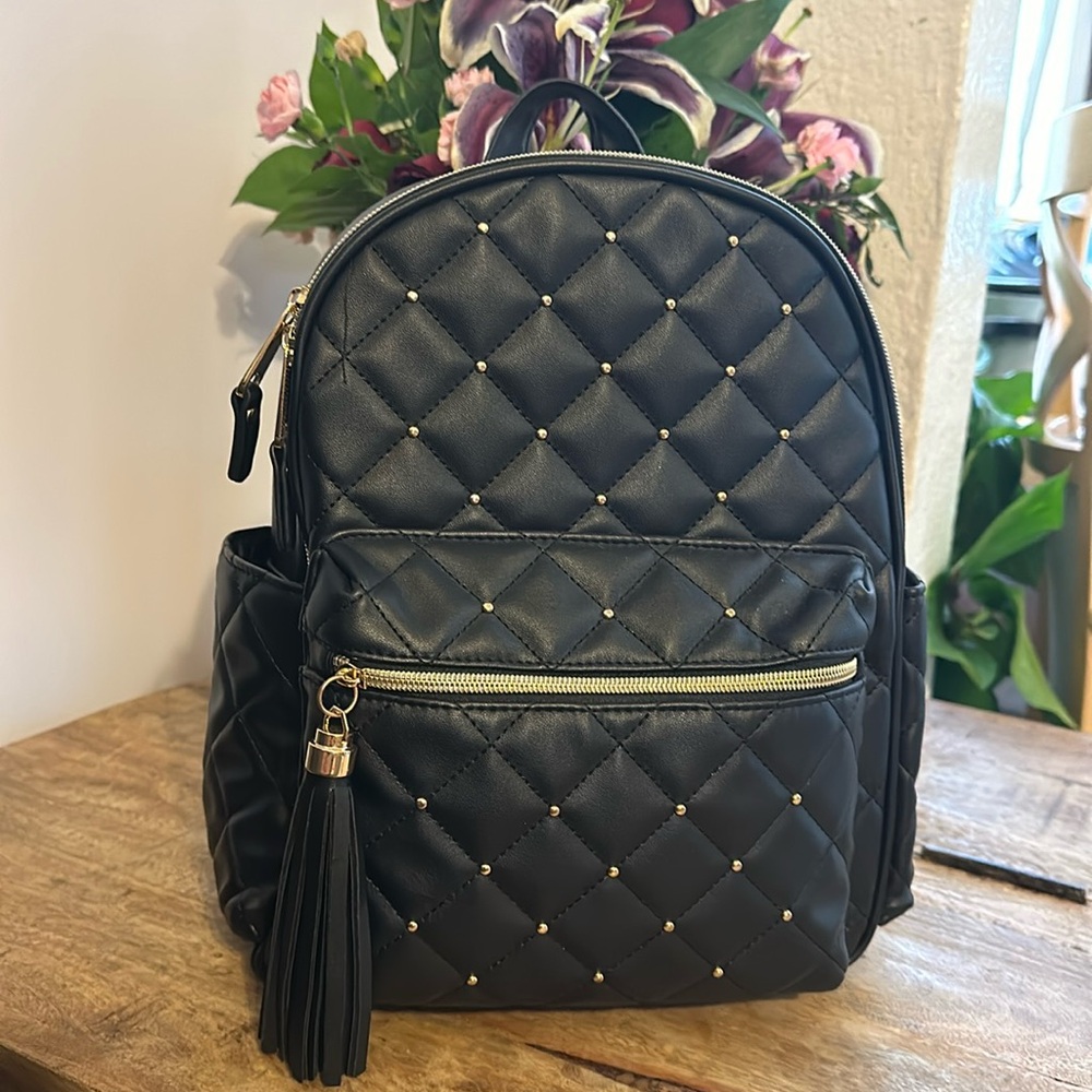 Claire’s backpack black with gold colored detailing
